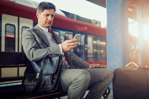 executive professional learning language on smartphone on a high-speed train