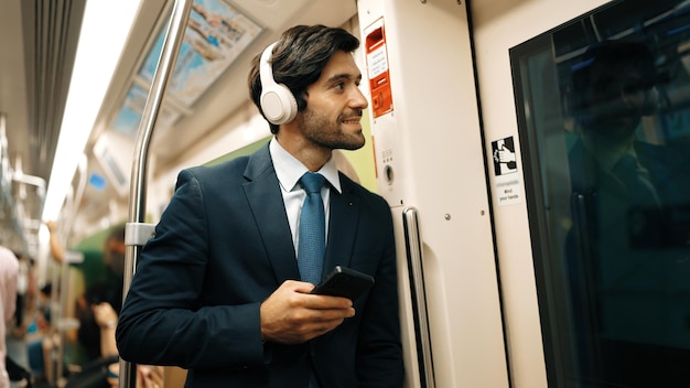 professional man commuting on Berlin U-Bahn using noise-canceling headphones