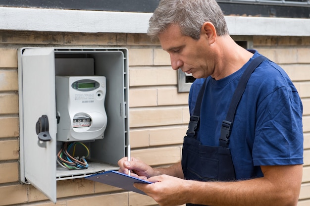 technician installing smart meter in UK home