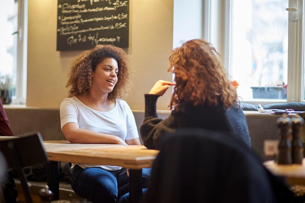 professional meeting with a language coach in a cafe