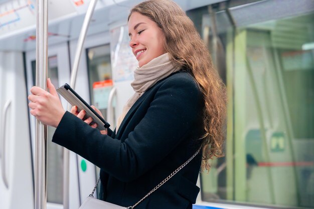 person using smartphone at a digital kiosk in Sweden